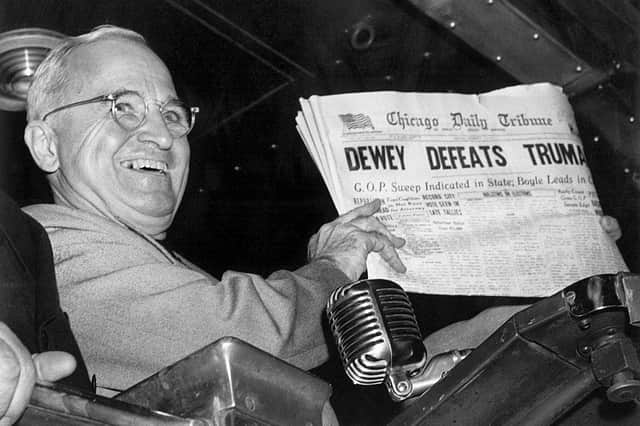President Harry S Truman holds up an election day edition of the Chicago Daily Tribune, which – based on early results – mistakenly announced ‘Dewey Defeats Truman’  Pic: Byron Rollins/AP