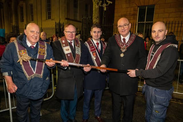 Philip Gillen, Drew McIntyre and Chris Wilson from the No Surrender Club are presented with taper before the burning of the effigy of Lundy, by Governor William Walker and his son Ben.