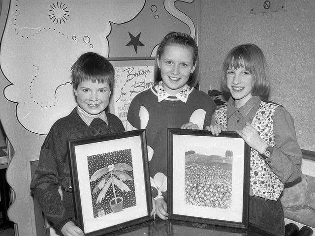 Brushing up on success at the end of February 1992 are John Magill, St Patrick’s Primary School, Ballycastle, Lee Cunningham and Sarah Armstrong, Armstrong Primary School, Armagh, the Northern Ireland winners of the Britain in Bloom children’s painting competition. Picture: News Letter archives