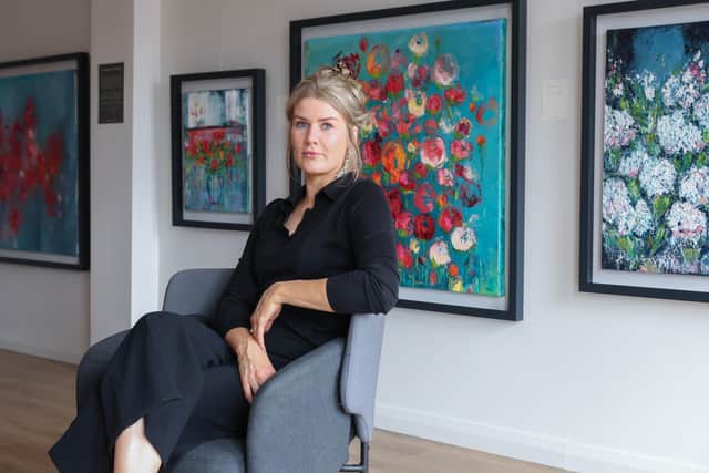 Belfast artist Anna McKeever at her Ormeau Road studio with work from latest collection 'I Brought You Flowers'