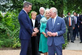 King Charles and Queen Camilla pictured with John Finucane MP North Belfast today at newly-created Coronation Garden in Newtownabbey, designed by Diarmuid Gavin.King Charles and Queen Camilla have arrived in Northern Ireland for of a two-day visit. Their first visit since their coronation earlier this month.