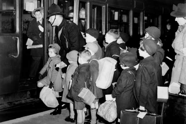 London schoolchildren carry gas masks and luggage September 1, 1939, as they leave by train for evacuation to Devon at the start of the Second World War. Picture: PA