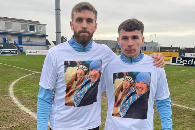 Ballymena United players pay tribute to Lydia Ross during their warm-up at Mourneview Park. PIC: Ballymena United FC
