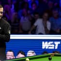 Mark Allen before potting the black and making a 147 in his quarter final match against Mark Selby (not in picture) during day six of the MrQ Masters at Alexandra Palace, London. PIC: Steven Paston/PA Wire.