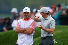 Rory McIlroy and caddie Harry Diamond react on the 18th green during the second round of the 2023 PGA Championship at Oak Hill Country Club