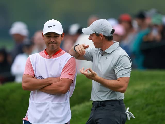 Rory McIlroy and caddie Harry Diamond react on the 18th green during the second round of the 2023 PGA Championship at Oak Hill Country Club