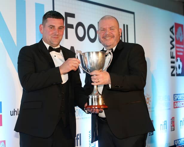 Donal McConnell of Reavey’s Solicitors presents the Manager of the Year to Loughgall's Dean Smith