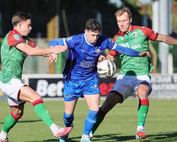 Limavady's Lewis Tosh is closed down by Glentoran's Jack Malone and Gregory Sloggett. (Photo by David Maginnis/Pacemaker Press)