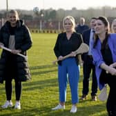 First Minister Michelle O'Neill (centre), Deputy First Minister Emma Little-Pengelly (right), and Junior Minister Aisling Reilly (left) during a visit to St. Paul's GAA club in west Belfast on Wednesday. Pic: Niall Carson/PA Wire