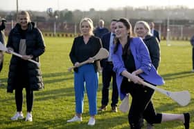 First Minister Michelle O'Neill (centre), Deputy First Minister Emma Little-Pengelly (right), and Junior Minister Aisling Reilly (left) during a visit to St. Paul's GAA club in west Belfast on Wednesday. Pic: Niall Carson/PA Wire