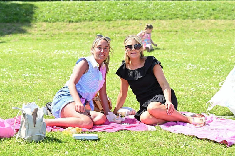 Sun worshippers pictured at Hazelbank park in Newtownabbey as the spell of very warm weather continues. Patricia McFadden and Seaneen McKeown