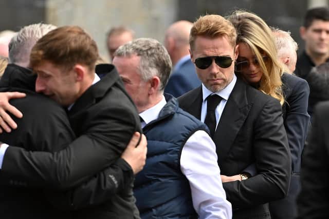 Ronan Keating and wife Storm (right) outside St Patrick's Church in Louisburgh, Co Mayo, after the funeral of his brother Ciaran Keating. The older brother of Ronan Keating died in a two-car crash near Swinford in Co Mayo on Saturday. Picture date: Thursday July 20, 2023. PA Photo. See PA story FUNERAL Keating. Photo credit should read: Oliver McVeigh/PA Wire