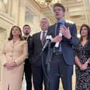 Stormont Opposition leader Matthew O'Toole (centre) speaks to media in the Great Hall at Parliament Buildings, Belfast ahead of leading the SDLP into the Assembly chamber for the second Opposition Day