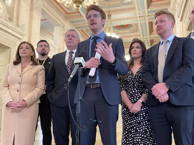 Stormont Opposition leader Matthew O'Toole (centre) speaks to media in the Great Hall at Parliament Buildings, Belfast ahead of leading the SDLP into the Assembly chamber for the second Opposition Day