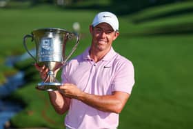 Northern Ireland's Rory McIlroy celebrates with the trophy after winning a record-extending fourth Wells Fargo Championship. (Photo by Andrew Redington/Getty Images)