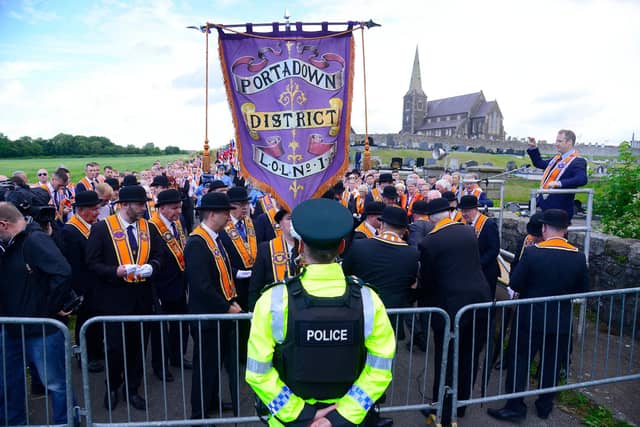 Orangemen being halted from proceeding down the Garvaghy Road by police in 2023; they have been unable to march that route since 1998 when the Parades Commission came into effect