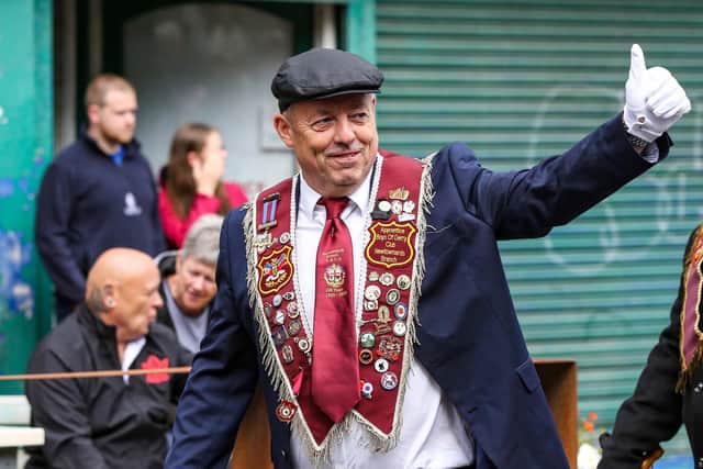 A wave to the crowds from this member of the Apprentice Boys