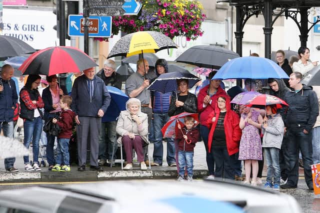 Umbrellas where an important part of the day as the crowds shelter from the rain during the Ballymena Twelfth
