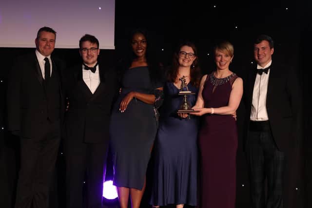 Belfast financial services consultancy firm fscom wins big at Compliance Register Platinum Awards in London. Pictured are fscom managing director Jamie Cooke, senior compliance associate Andrew Johnston, associate director Azariah Nukajam, associate director Heather O’Gorman and director Alison Donnelly with the awards