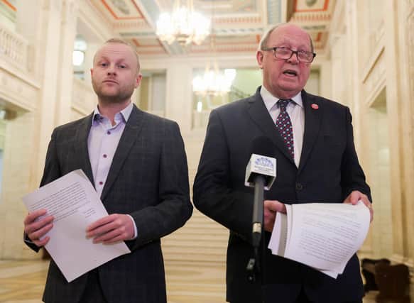Loyalist blogger Jamie Bryson pictured in Parliament Buildings at Stormont with TUV leader Jim Allister presenting a legal document about the return on the Northern Ireland Assembly.