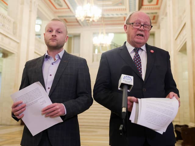 Loyalist blogger Jamie Bryson pictured in Parliament Buildings at Stormont with TUV leader Jim Allister presenting a legal document about the return on the Northern Ireland Assembly.