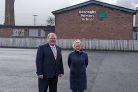 Lisburn North DUP councillor Jonathan Craig and vice-chair of Derriaghy Village Community Group, Adraina Landa at the site of the school which has been earmarked for redevelopment. Pic credit: LDRS