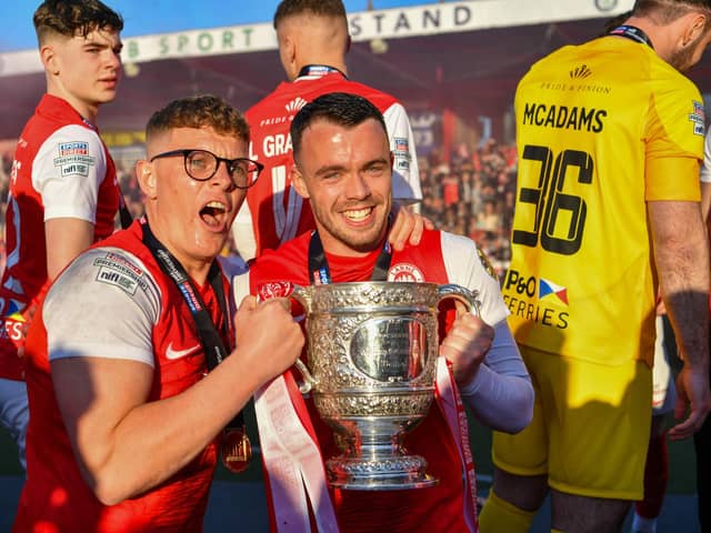 Chris Gallagher and Levi Ives celebrate with the Gibson Cup. PIC: Andrew McCarroll/ Pacemaker Press
