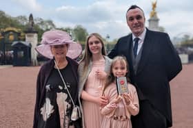 Michael Boyd OBE pictured at Buckingham Palace with proud mum Jacqueline Granleese and two daughters Rachel and Olivia