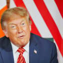 Asked by reporters about the prospect of a united Ireland, Donald Trump said he doesn't want to 'cause any problems' but thinks it would be a 'great thing', adding: 'I'd love to see it unified'