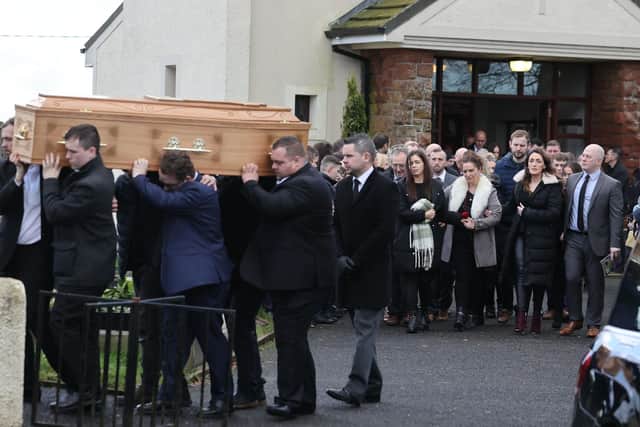 The coffin of Patrick Rogers is carried from his funeral service at St Joseph and St Malachy's Church, Drummullan. Picture date: Friday December 30, 2022.