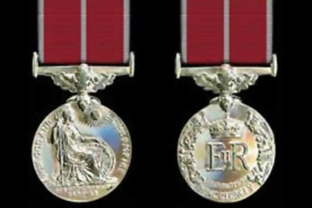 William Ewart's British Empire Medal is similar to that in the picture above, but without the white stripe on the medal ribbon. It has his name written along the side.