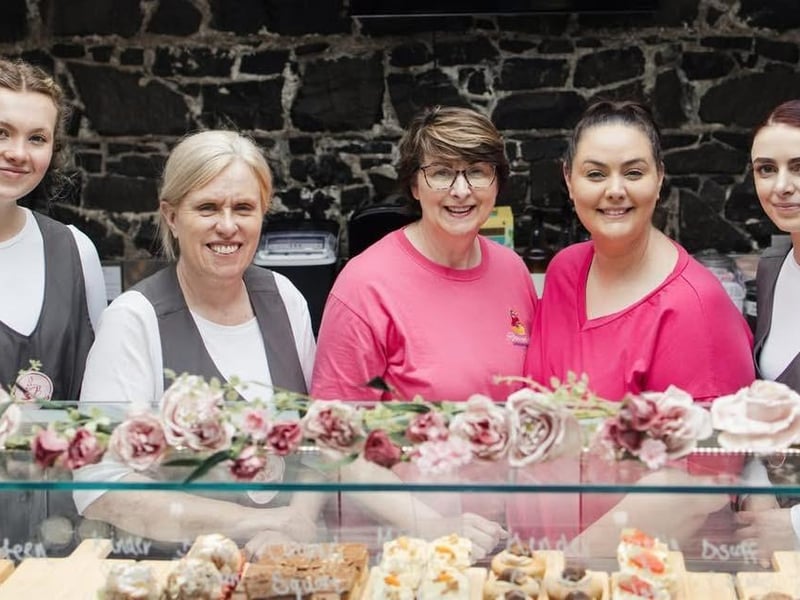 Rhiannon Woolsey of Rhiannon’s Café pictured with staff at the opening of the Portadown venture