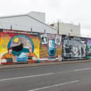 A pioneering travel company, set up by a father on his paternity leave, is launching its inaugural tour promising to uncover a side of Belfast rarely found in tourist books. Pictured are the famous political murals along The Falls Road in Belfast, Northern Ireland.  There have been nearly 2,000 murals documented in Northern Ireland since the 1970s, mostly depicting the region's past and present political and religious divisions, or other aspects of Irish history or culture