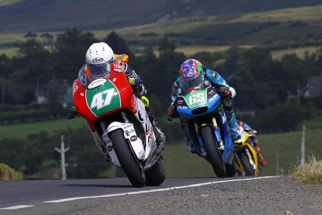 Richard Cooper (Jack Reid Cars/KMR Kawasaki) and Michael Sweeney (MSR Aprilia) in action during Supertwin qualifying at Armoy. (Photo by Rod Neill/Pacemaker Press)