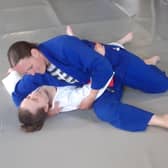 Collette in a judo hold