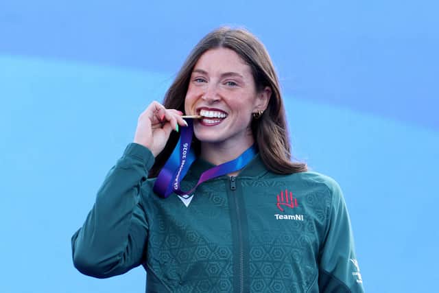 Commonwealth Games gold winner Kate O'Connor enjoying the medal presentation in Glasgow following her women's heptathlon glory. (Photo by Lintao Zhang/Getty Images)