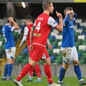 Linfield and Cliftonville finished on level terms last night at Windsor Park