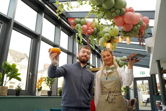 Launching Millies’ stylish new ‘Green House’ is Eoin Trainor-O’Neill, manager, and Ciara Hamill, bar staff member