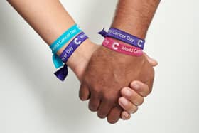 Show your solidarity by wearing a Cancer Research UK unity band for World Cancer Day