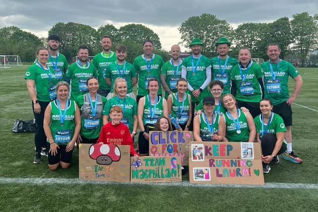 Bushmills natives Laura Harpur and Mark McKeown rounded up 20 friends and family to run with them in the Belfast Marathon relay for MacMillan Cancer.