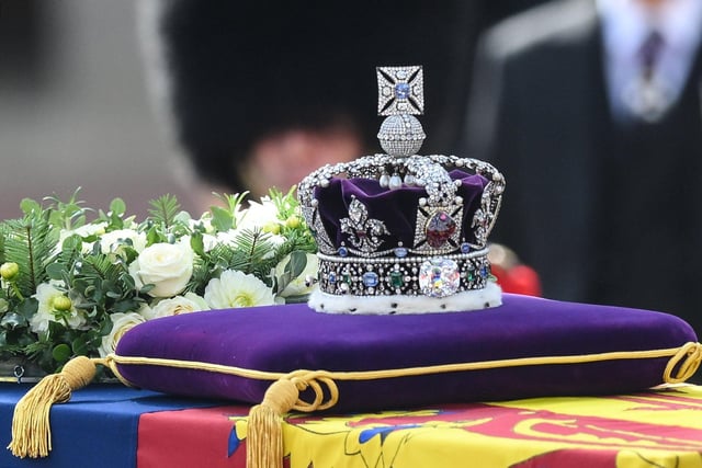 The gun carriage bearing the coffin of the late Queen Elizabeth II departs Buckingham Palace, transferring the coffin to The Palace of Westminster on September 14, 2022 in London, United Kingdom