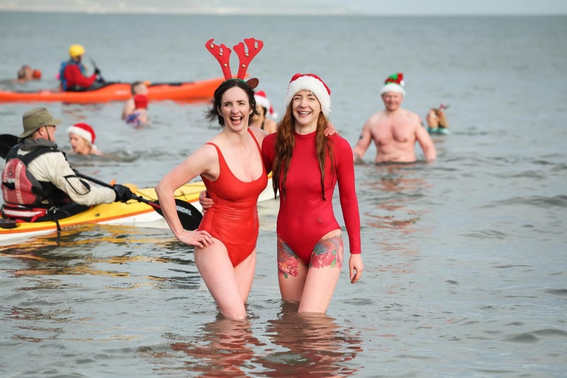 Gillian and Helen Armstrong joins swimmers from north Down take part in the annual Santa Splash at Helens Bay beach, County Down.