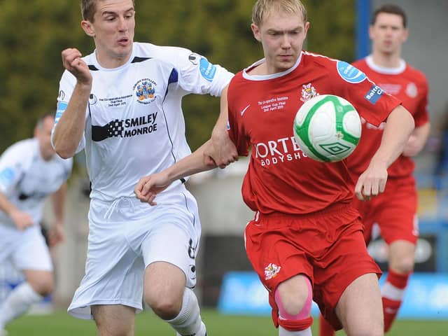 Current Portadown captain Gary Thompson playing against them for Lisburn Distillery in 2011. He's in action against Ross Redman - someone he now calls a teammate. PIC: Stephen Hamilton/Presseye