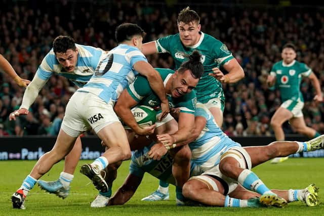 Ireland's James Lowe (centre) is tackled by Argentina's Tomas Albornoz (left) during the Autumn international match at the Aviva Stadium, Dublin on Friday. (Photo by Brian Lawless/PA Wire)