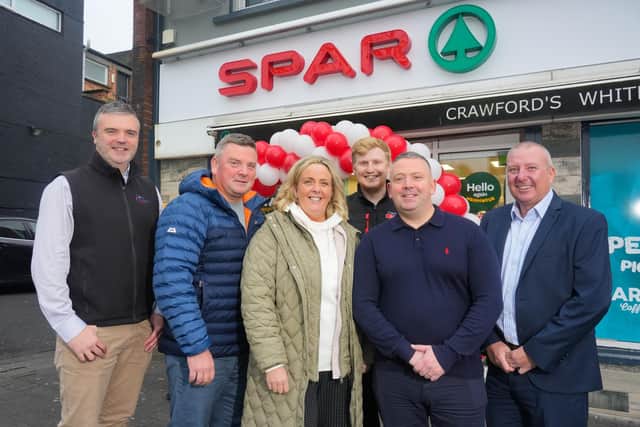 The Crawford family, owners of SPAR Whiterock Road, have invested £200,000 into a recent refit of their store to expand their services and offering for the local community. Pictured is John McNeill from Henderson Group with Damien Crawford, Sarah Crawford, Jack McKenna, Mark Crawford and Davey Benett from Henderson Group