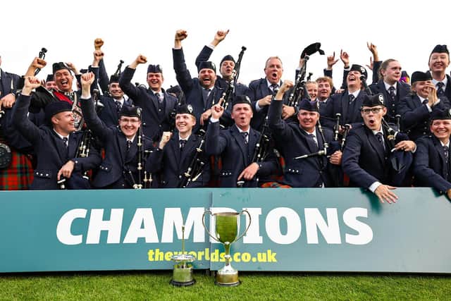 The Simon Fraser University Pipe Band celebrate their win during the World Pipe Band Championships (WPBC) at Glasgow Green