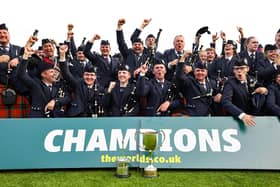 The Simon Fraser University Pipe Band celebrate their win during the World Pipe Band Championships (WPBC) at Glasgow Green