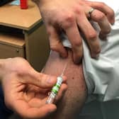Chief Medical Officer, Professor Sir Michael McBride receiving his Covid-19 vaccination in 2022.