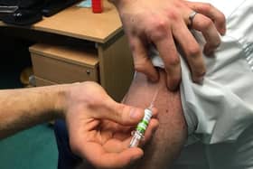 Chief Medical Officer, Professor Sir Michael McBride receiving his Covid-19 vaccination in 2022.