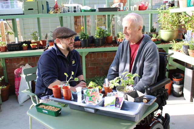 Head gardener Matthew Lee, left, and Paul Gannon enjoying a horticultural therapy workshop at Horatio's Garden, Musgrave Park Hospital